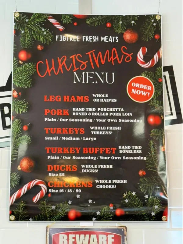 The Christmas menu board hanging in the shop